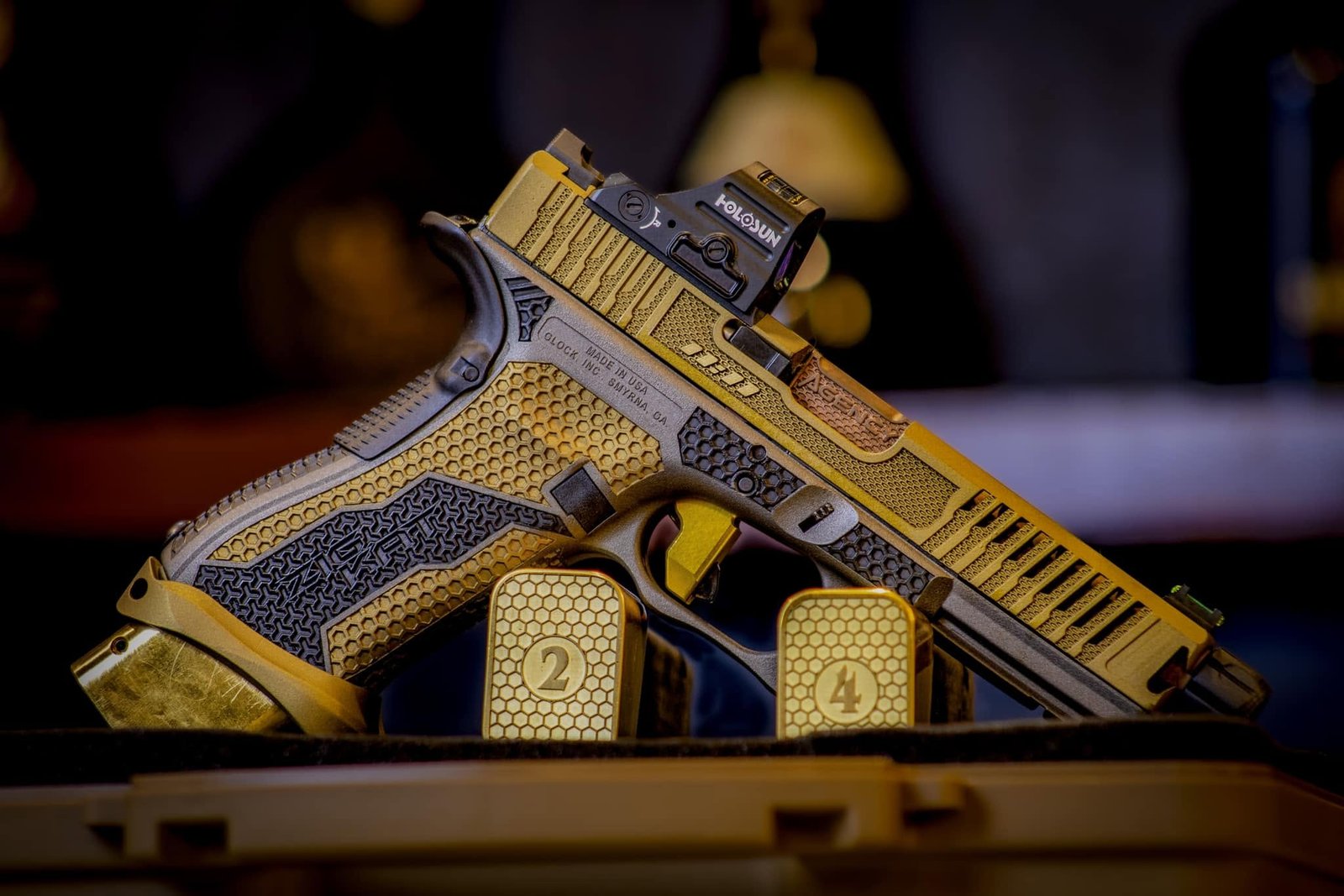 Custom black and bronze competition pistol showcasing Optimus craftsmanship